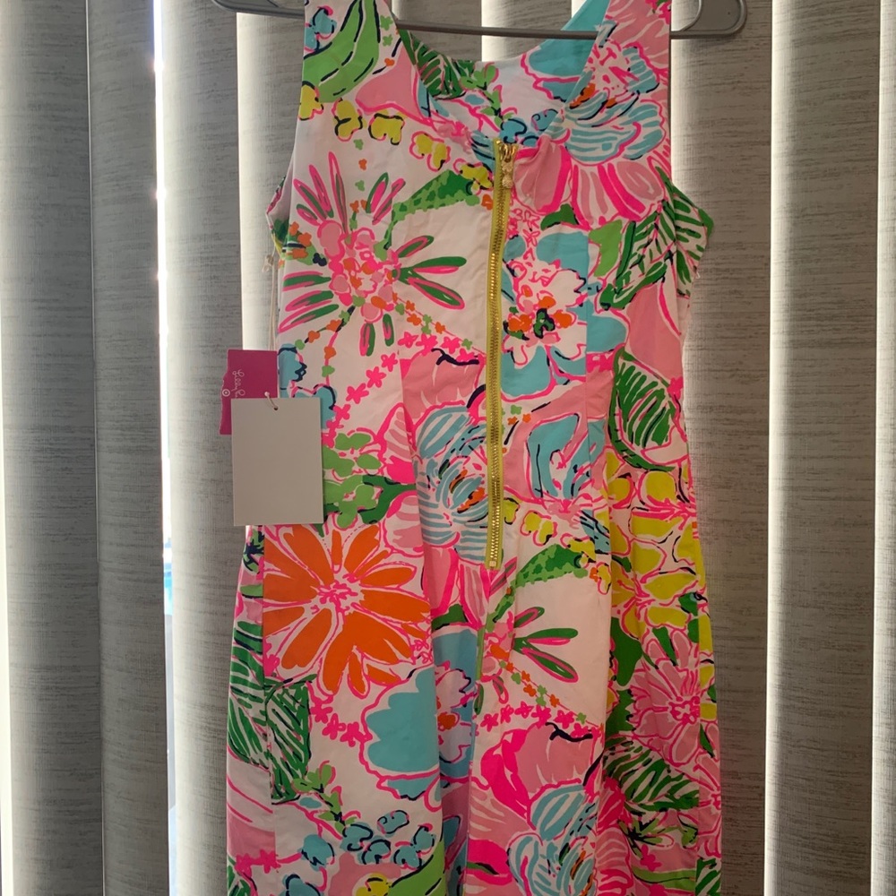 This dress is new with tags, never used.  Bright and fun…perfect for summer!